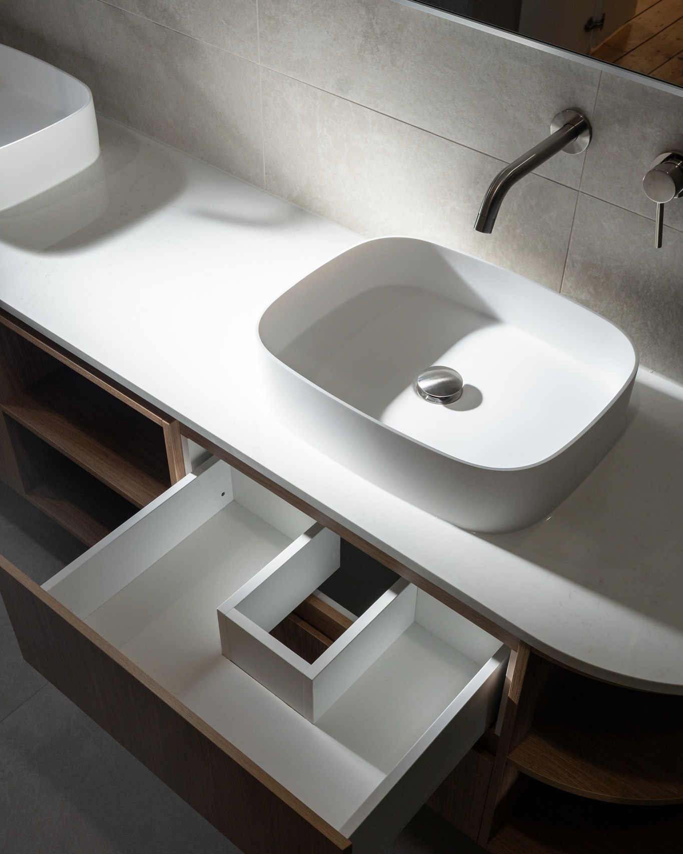 Dual floating vanity with vessel sinks and timber cabinetry