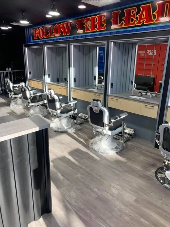 Barber Boys commercial shop fit-out with custom cabinetry and mirrored workstations